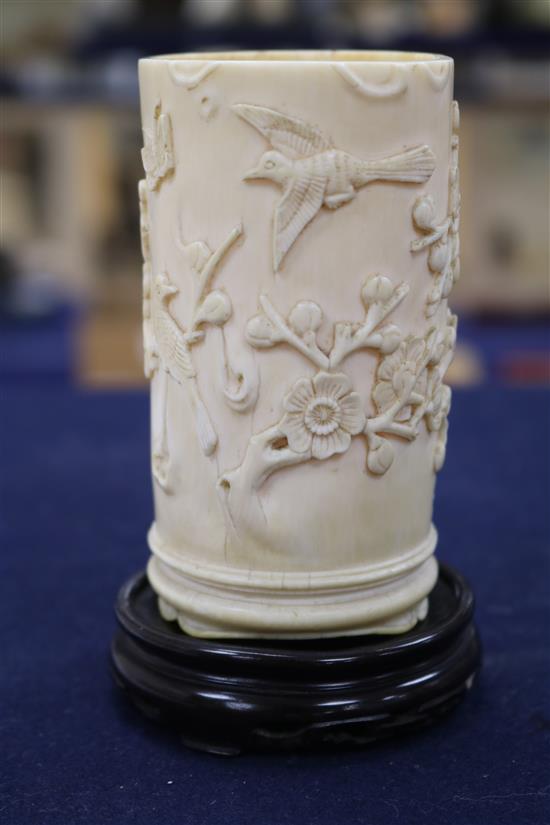 A Chinese ivory brush pot carved with prunus, calligraphy, etc. and an ivory seal H 10.5cm & 4cm